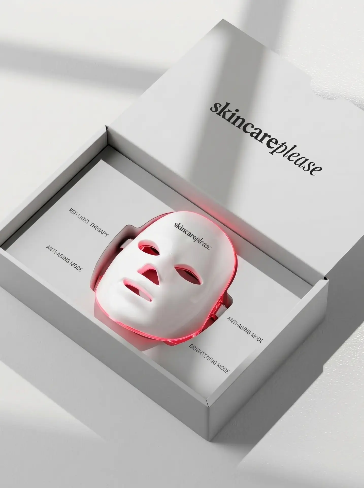 Máscara LED blanca de Skincare Please dentro de su caja de packaging